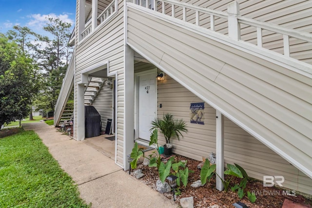 view of side of home featuring a balcony