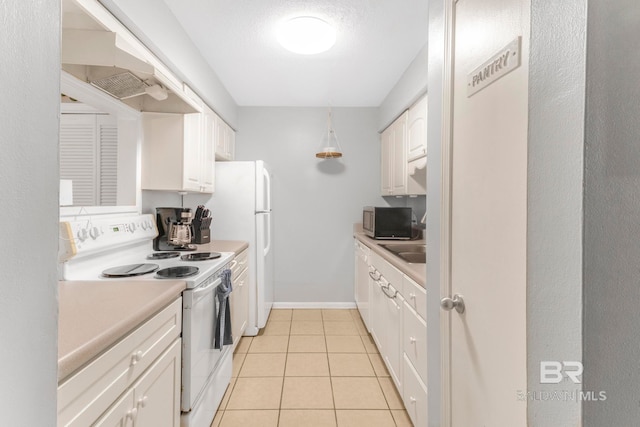 kitchen featuring light tile patterned floors, electric stove, white cabinetry, and a textured ceiling