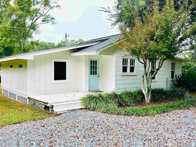 view of front of house with a wooden deck