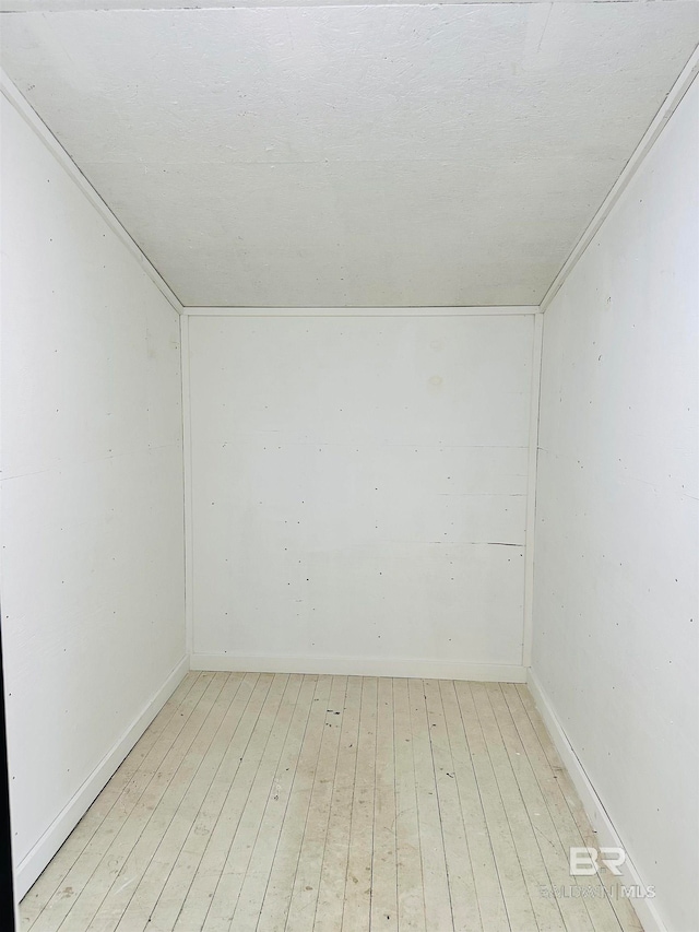 unfurnished room with light hardwood / wood-style floors