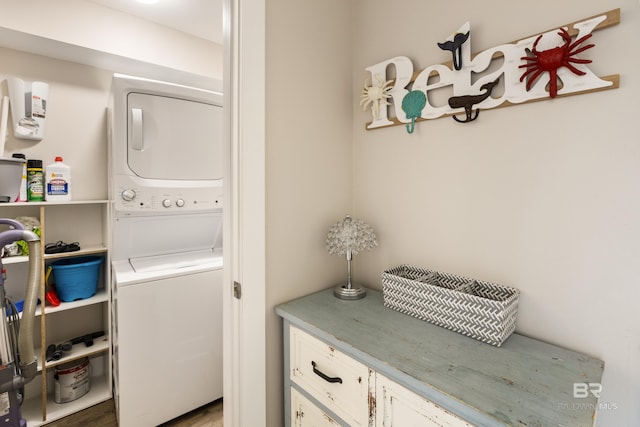 clothes washing area featuring laundry area and stacked washer and dryer