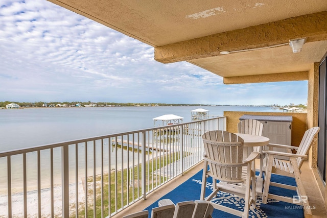 balcony featuring a water view