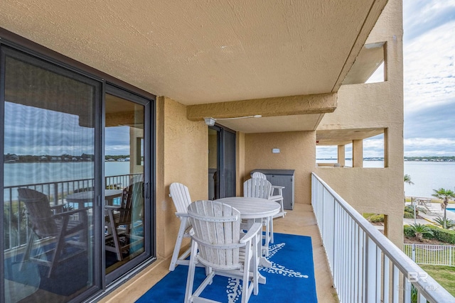 balcony featuring a water view