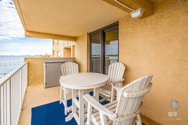 balcony with outdoor dining area