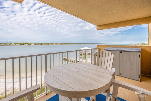 balcony featuring a water view