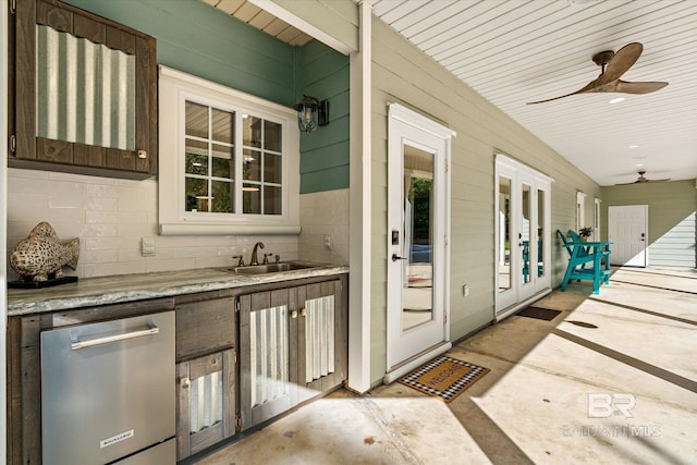 view of patio / terrace with a sink, a ceiling fan, and an outdoor kitchen