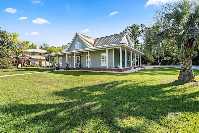 exterior space featuring a front yard, a porch, and metal roof