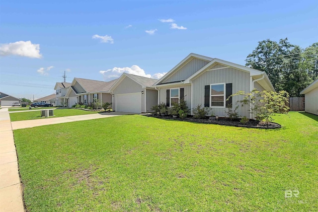 view of front of home featuring a front yard and a garage