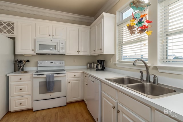 kitchen featuring white appliances, light hardwood / wood-style flooring, white cabinetry, and sink