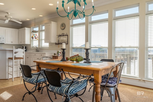 dining area featuring light tile patterned floors, ornamental molding, a wealth of natural light, and ceiling fan