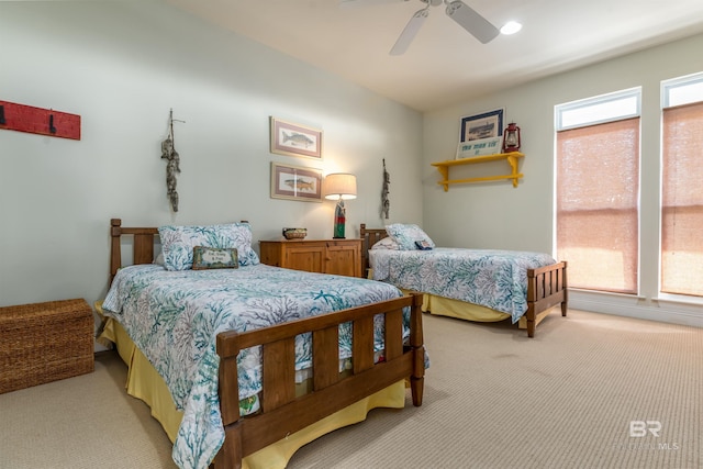 bedroom featuring light carpet and ceiling fan