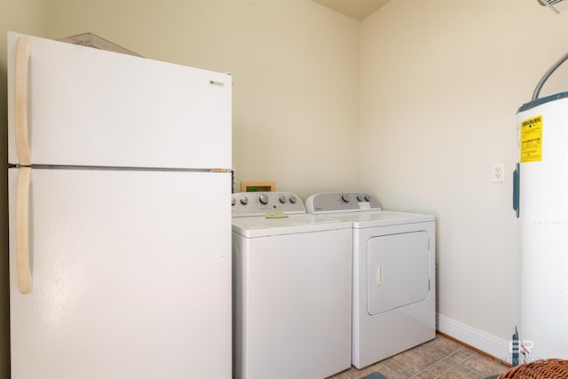 clothes washing area with electric water heater and washing machine and clothes dryer