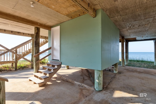 view of patio with a water view