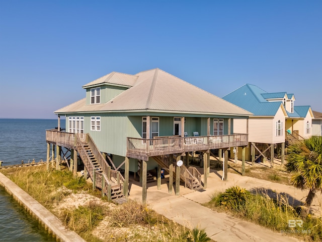 rear view of property featuring a water view