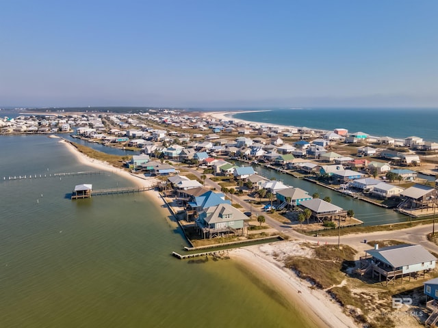 bird's eye view with a water view and a beach view