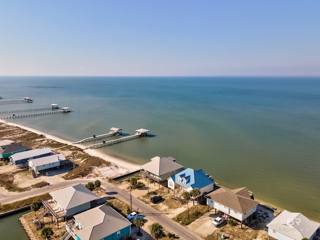 drone / aerial view with a water view and a view of the beach