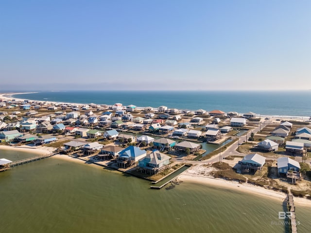 drone / aerial view featuring a view of the beach and a water view