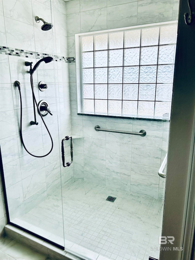 bathroom featuring an enclosed shower