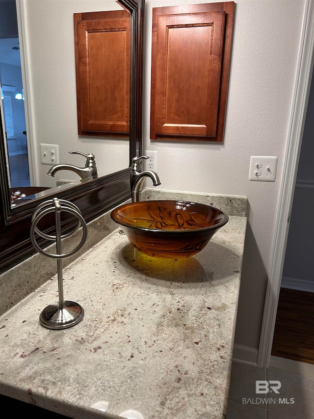 bathroom with vanity and tile patterned flooring