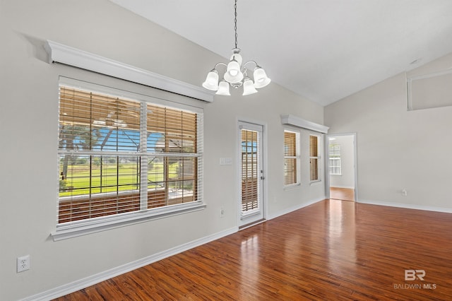 421 Collinwood Loop, Foley, AL 36535 - unfurnished dining area with baseboards, wood finished floors, a chandelier, and high vaulted ceiling