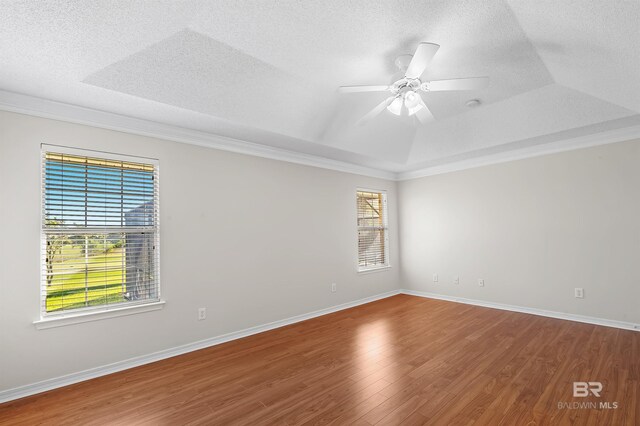 421 Collinwood Loop, Foley, AL 36535 - empty room with a raised ceiling, ornamental molding, and wood finished floors