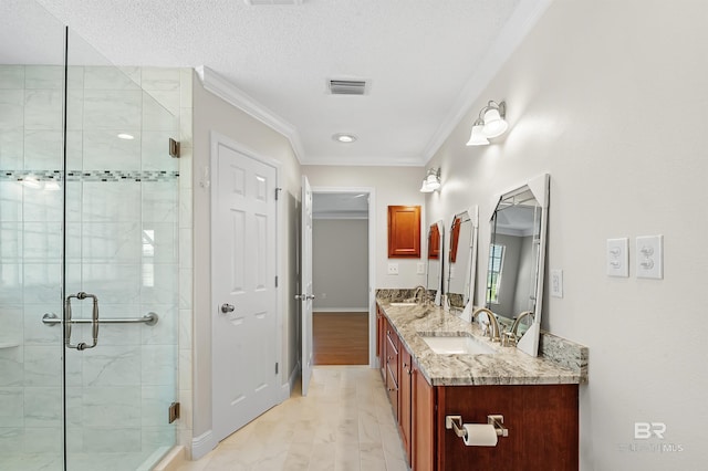 bathroom featuring a textured ceiling, wood-type flooring, vanity, walk in shower, and crown molding