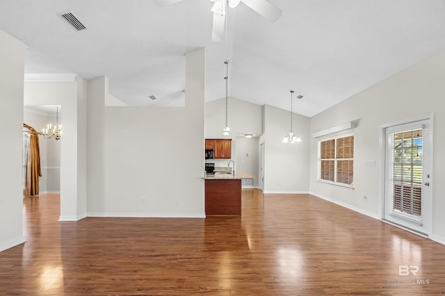 unfurnished living room featuring sink, ceiling fan with notable chandelier, high vaulted ceiling, and dark hardwood / wood-style flooring