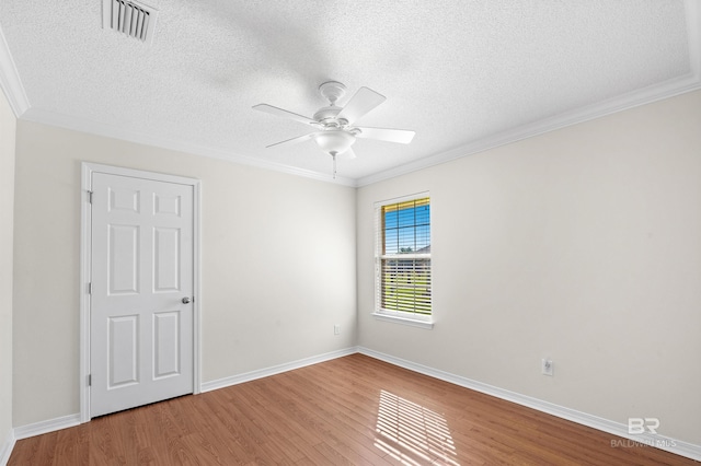 421 Collinwood Loop, Foley, AL 36535 - bathroom featuring a textured ceiling, visible vents, crown molding, vanity, and toilet