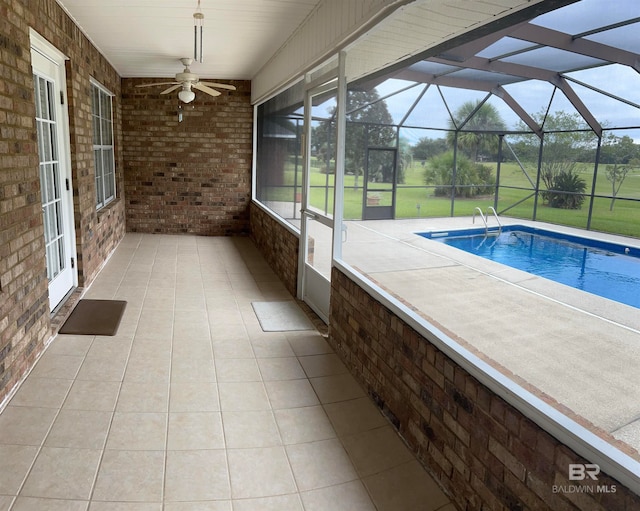 view of swimming pool with a lanai, a patio area, and ceiling fan