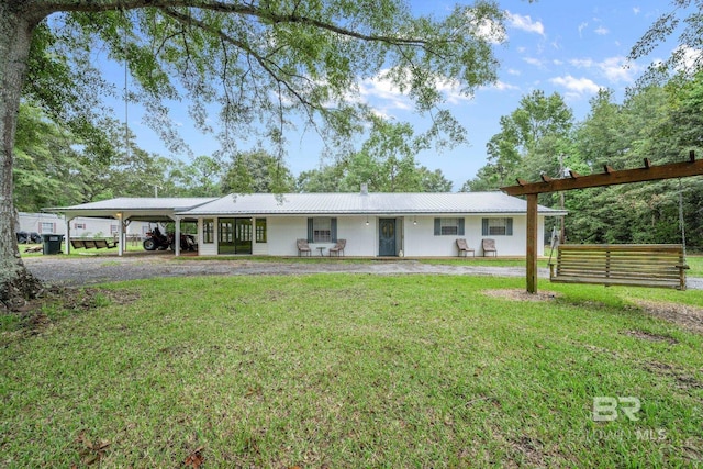 single story home featuring a carport and a front yard