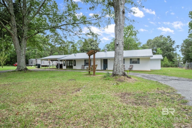 ranch-style home featuring a front yard