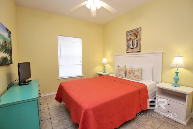 tiled bedroom with a ceiling fan and baseboards