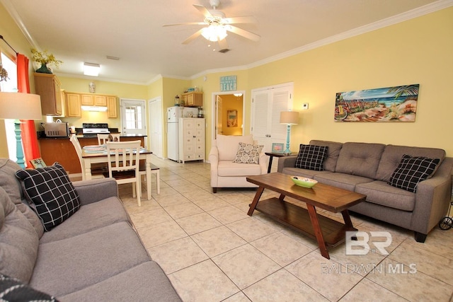 living room with a ceiling fan, light tile patterned flooring, and crown molding