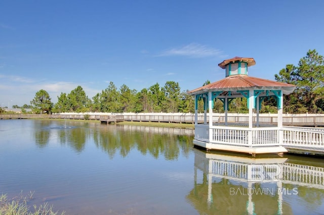 view of dock with a water view and a gazebo