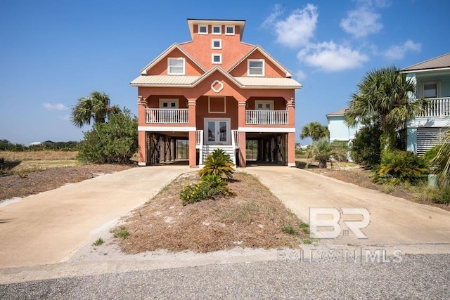 raised beach house with a balcony