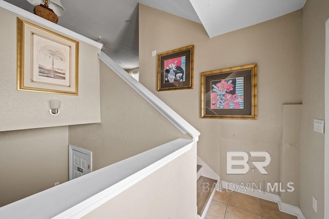 staircase with light tile floors
