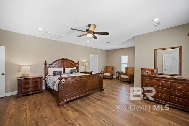 bedroom featuring ceiling fan and hardwood / wood-style floors