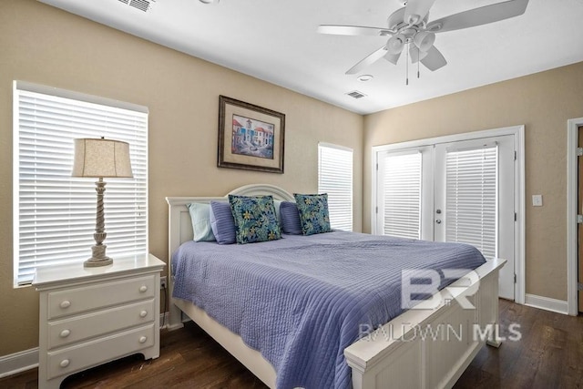 bedroom featuring dark hardwood / wood-style flooring, ceiling fan, and french doors