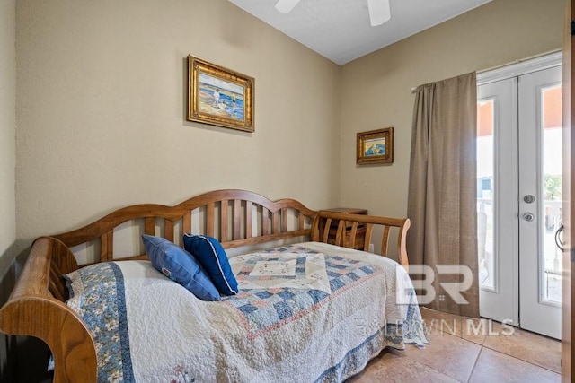 tiled bedroom with ceiling fan, french doors, and multiple windows
