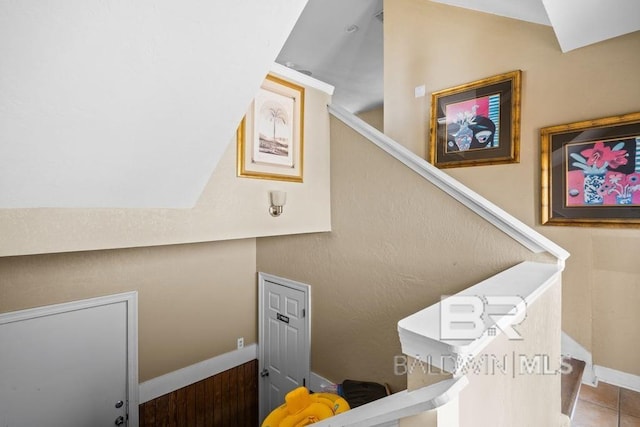 stairs featuring tile floors
