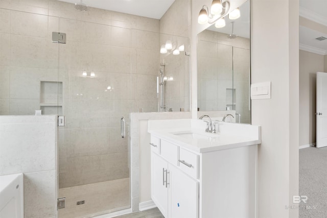 full bathroom with visible vents, vanity, ornamental molding, baseboards, and a stall shower