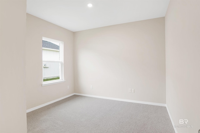 spare room with baseboards, carpet floors, and recessed lighting