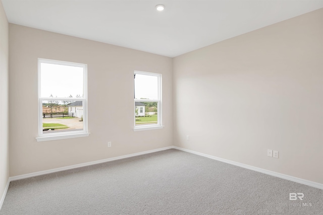 carpeted spare room with baseboards and recessed lighting