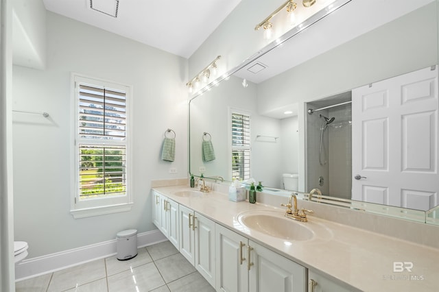 8160 Bay View Dr, Foley, AL 36535 - full bath featuring toilet, baseboards, tile patterned floors, a shower, and double vanity