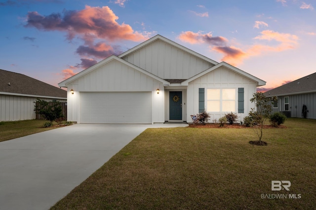 ranch-style home with a garage, a front yard, concrete driveway, and board and batten siding