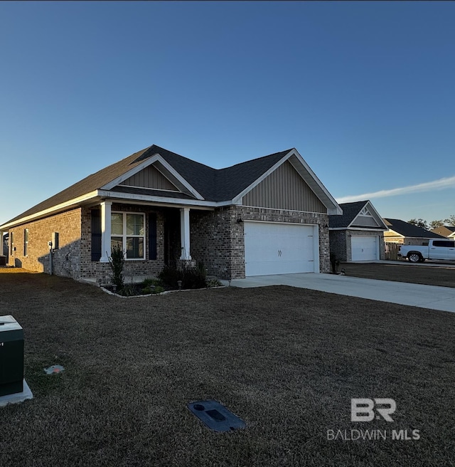 view of front of house with a garage and a front lawn