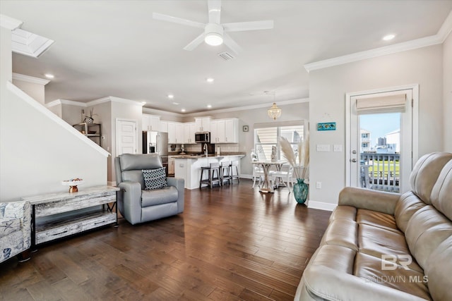 living room with ceiling fan, dark hardwood / wood-style floors, and ornamental molding