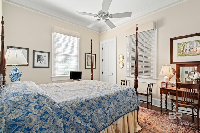 bedroom with ceiling fan, ornamental molding, and dark hardwood / wood-style floors