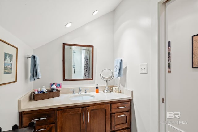 212 S Cedar St, Mobile, AL 36602 - bathroom with vanity, vaulted ceiling, and recessed lighting
