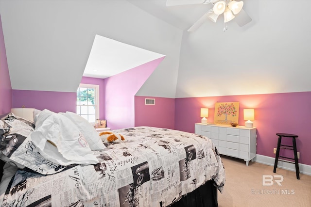 carpeted bedroom with ceiling fan and vaulted ceiling